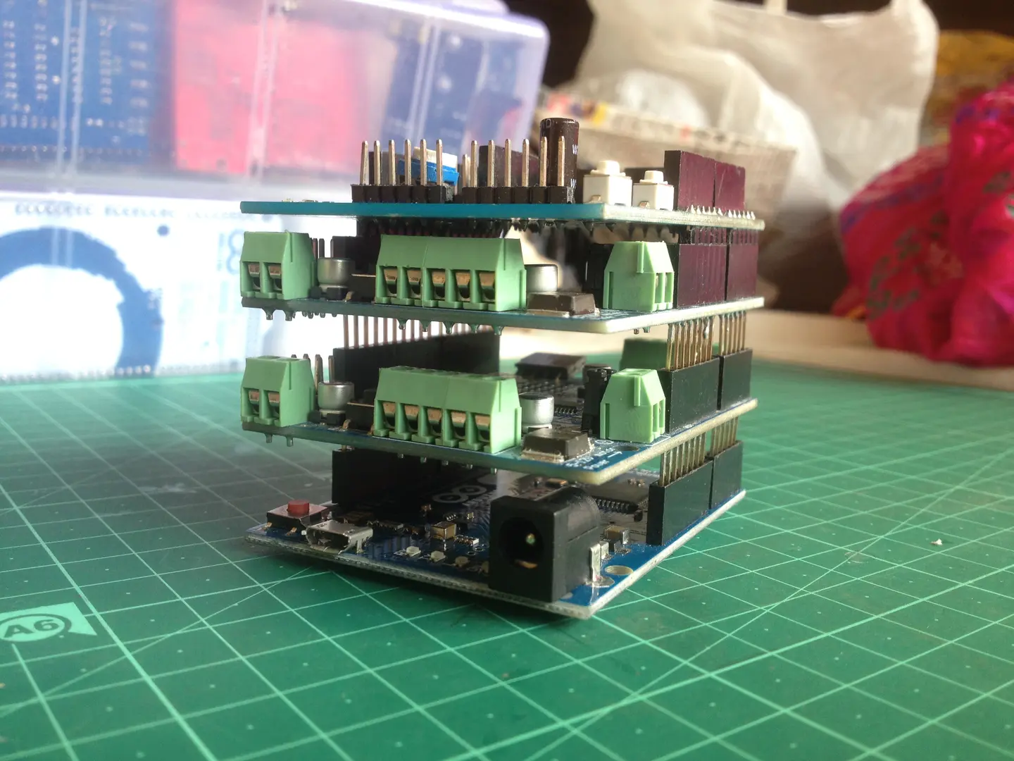 An Arduino board with multiple stacked shields arranged for a hardware prototype.